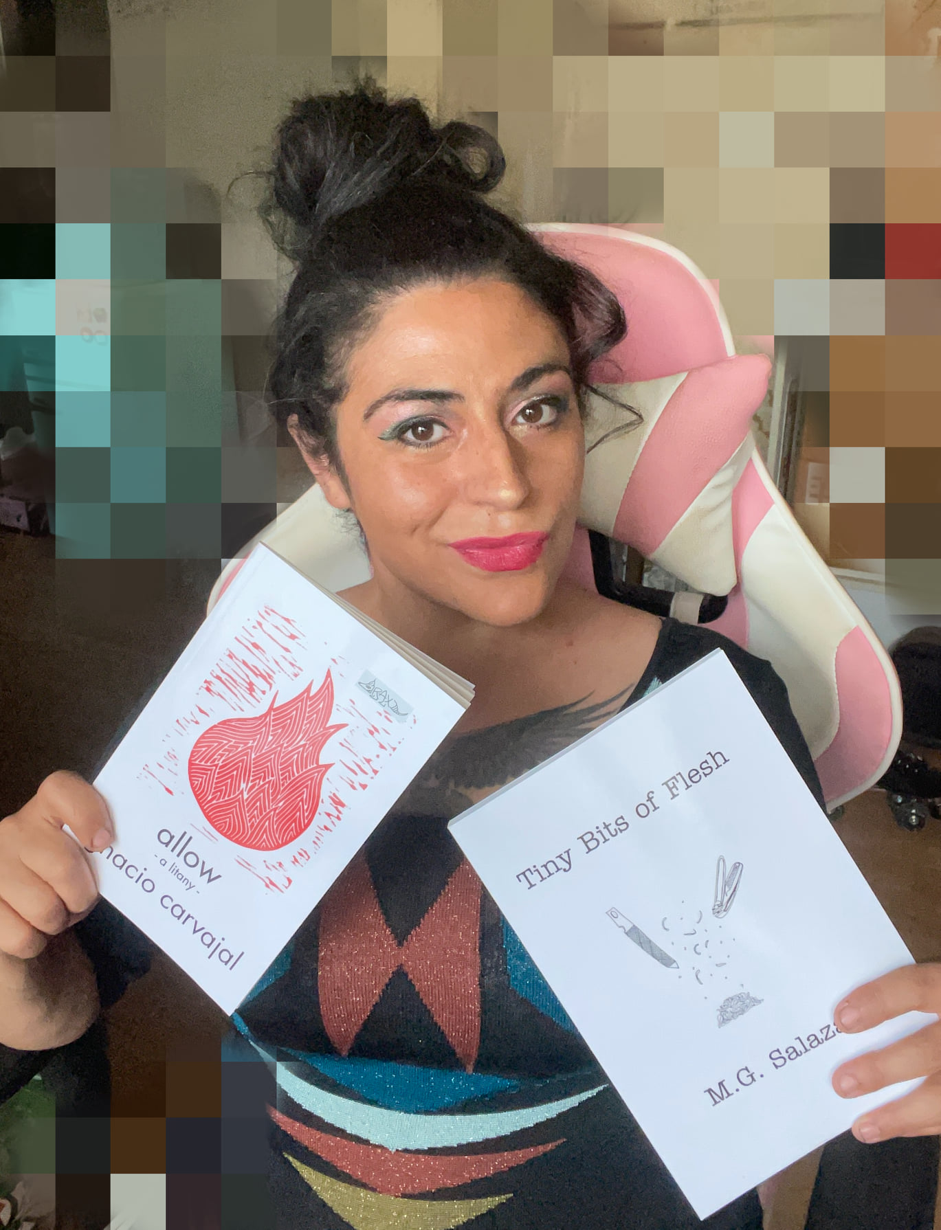 Niña Terca holding two of her published chapbooks