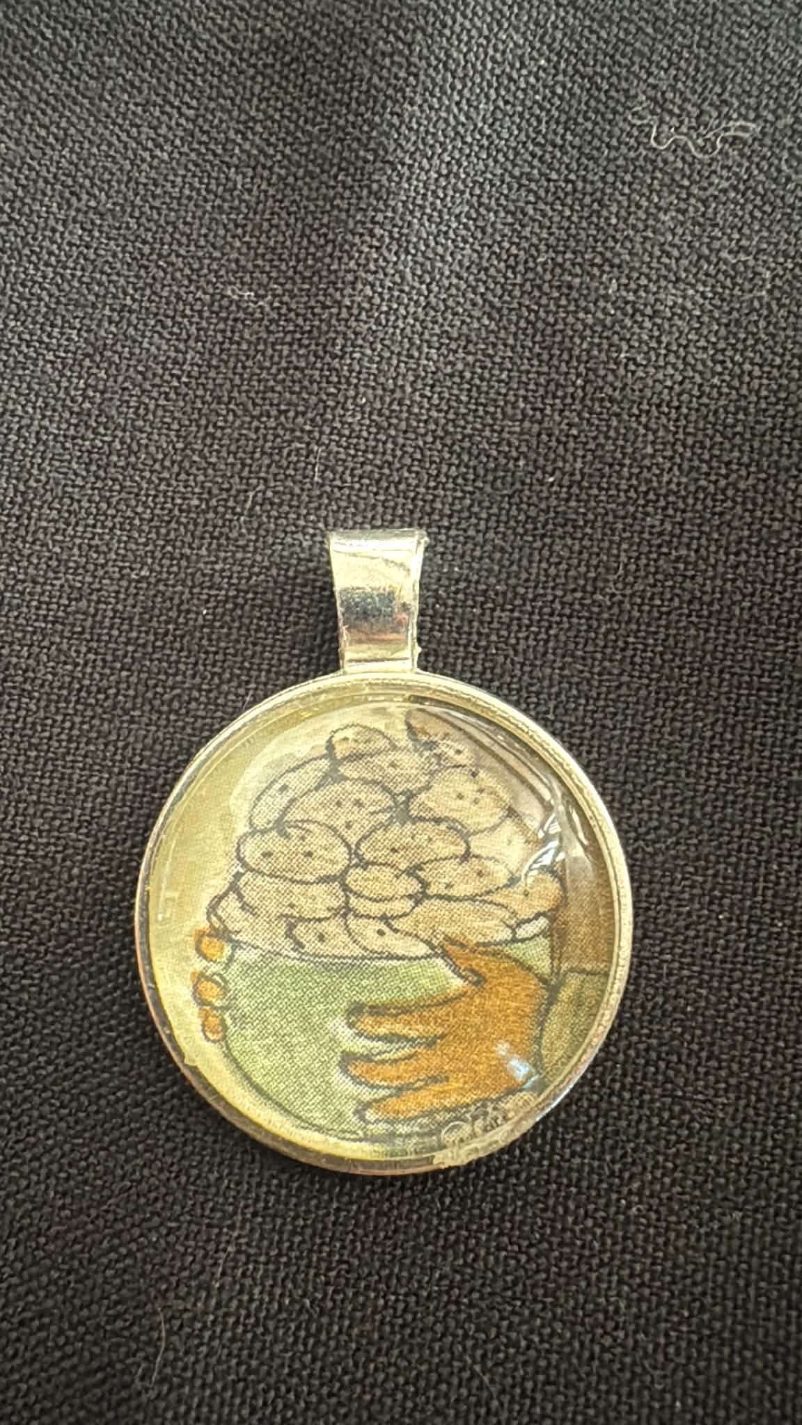 Pendant made from a vintage illustrated fragment