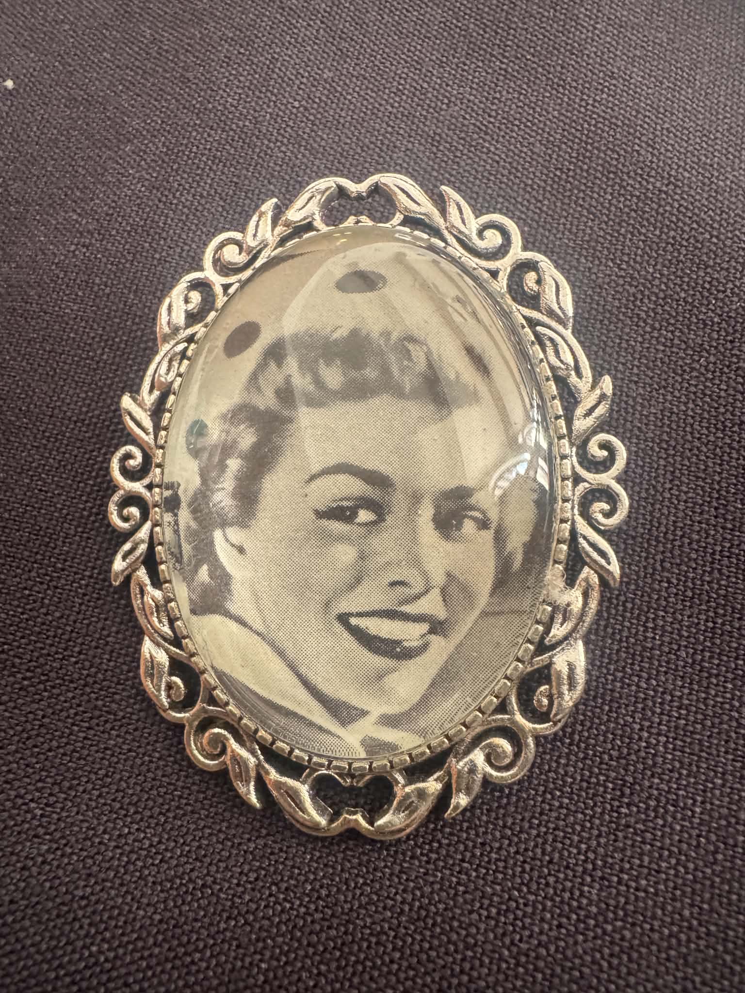 Pendant made from a vintage photo portrait fragment, in an ornate frame